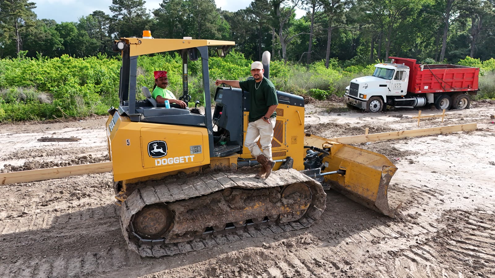 Apex Group crew operating bulldozer on site